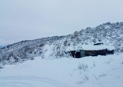 Scenic view of snow covered mountain against clear sky