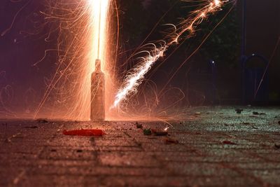 Firework display on road at night