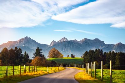 Empty road amidst land