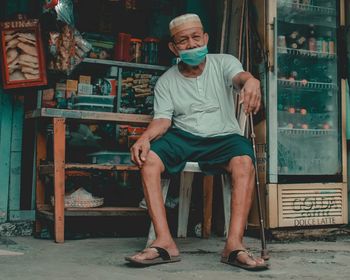 Portrait of man sitting on chair