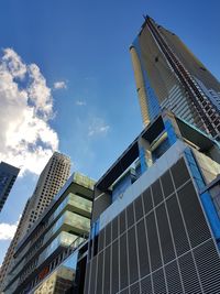 Low angle view of modern buildings against sky in city