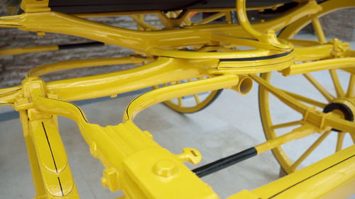 High angle view of yellow bicycle wheel