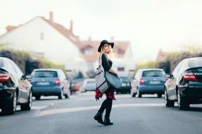 Woman standing on city street