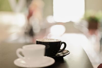 Close-up of coffee cup on table in cafe