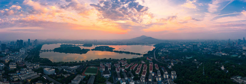High angle view of city at sunset