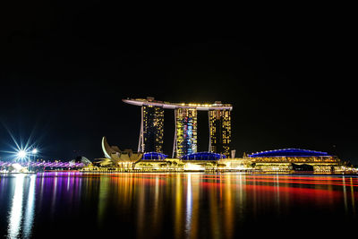 Illuminated modern buildings in city at night