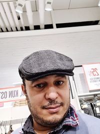 Portrait of young man wearing hat