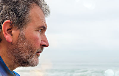 Close-up portrait of man looking away