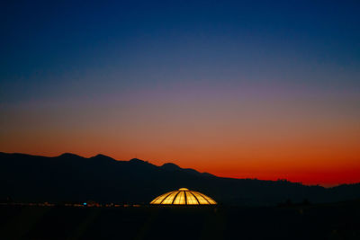 Silhouette mountain against clear sky at sunset
