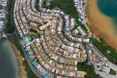 High angle view of buildings and trees in city