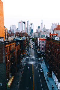 Road in city against clear sky