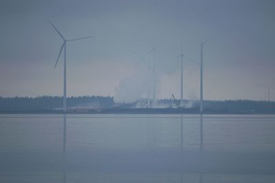 Scenic view of sea against sky during foggy weather