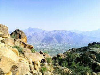 Scenic view of mountains against clear blue sky