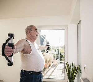 Senior man doing an arm exercise