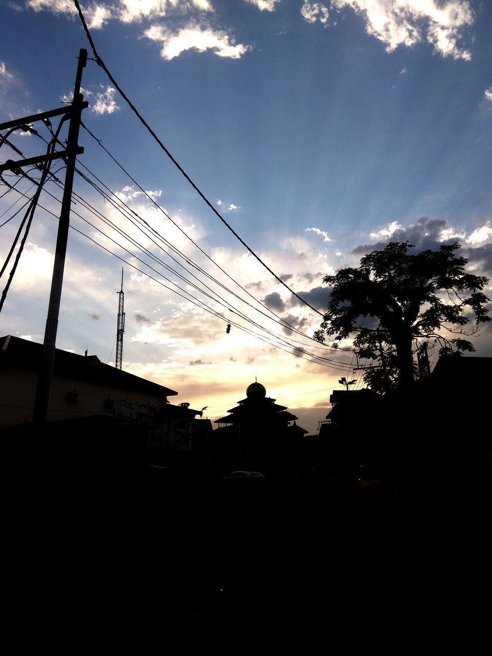 LOW ANGLE VIEW OF SILHOUETTE ELECTRICITY PYLONS AGAINST SKY