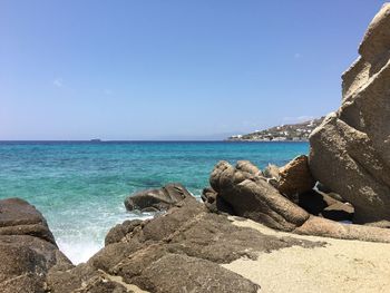 Scenic view of sea against clear blue sky