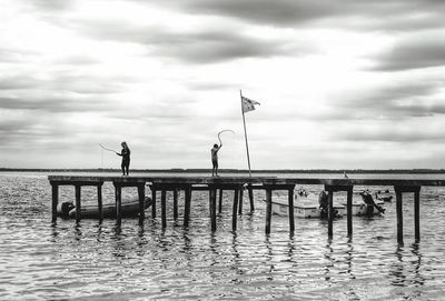 Pier over sea against sky