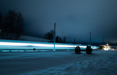 Light trail of a train at night near the vallée de joux