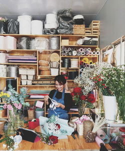 Woman standing in front of store