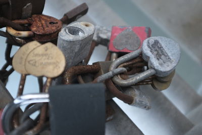 Close-up of padlocks on rusty chain