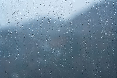 Full frame shot of wet glass window