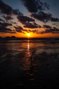 Scenic view of sea against romantic sky at sunset