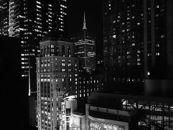 Modern buildings in city at night