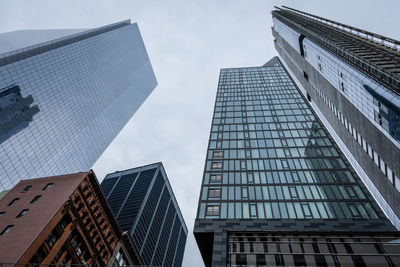 Low angle view of modern buildings against sky