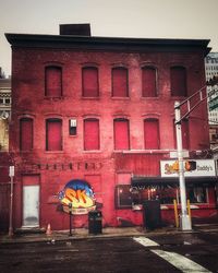 Man on red road against building in city