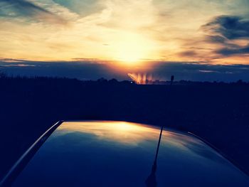 Scenic view of landscape against sky during sunset