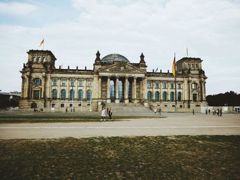 Group of people in front of historical building