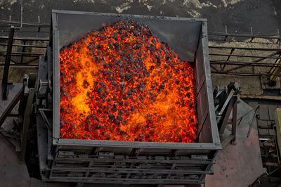 High angle view of burning charcoal in coal mine