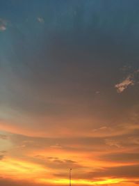 Low angle view of cloudy sky during sunset