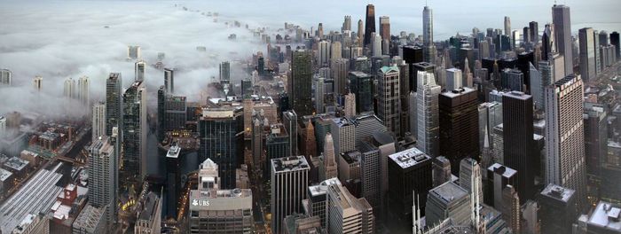 High angle view of modern buildings in city against sky