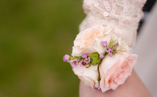 Close-up of hand holding bouquet