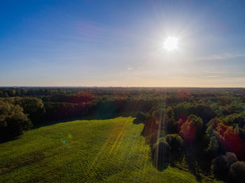 Scenic view of field against sky during sunset