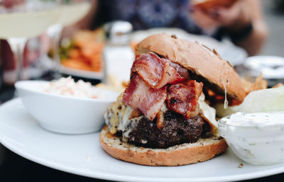 Close-up of hamburger in plate on table