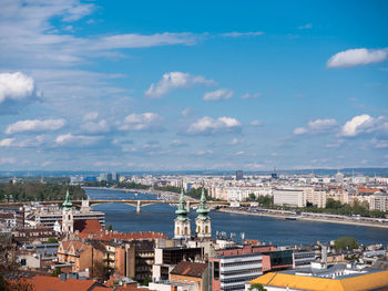 High angle view of city against cloudy sky