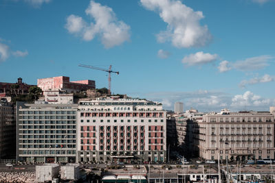 Buildings in city against sky