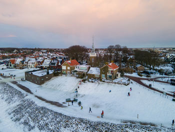 High angle view of crowd in city during winter