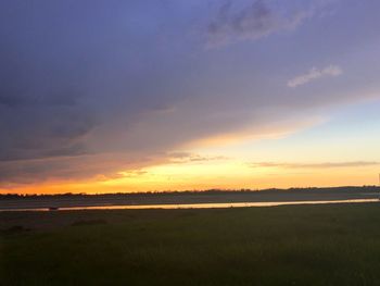 Scenic view of landscape at sunset