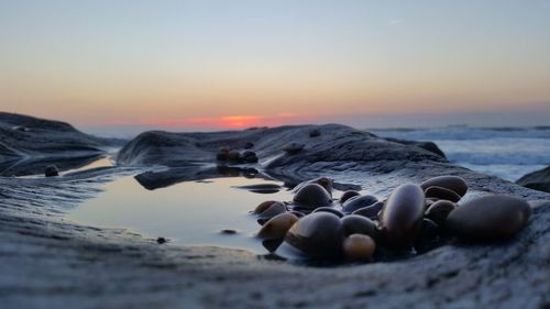 Scenic view of sea against sky at sunset