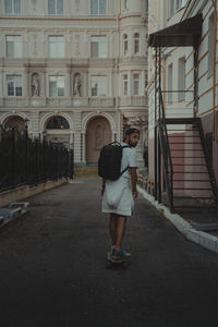 Rear view of woman walking on street