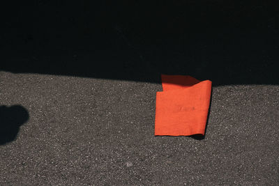 High angle view of red flag on street