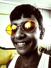 Portrait of smiling boy wearing sunglasses