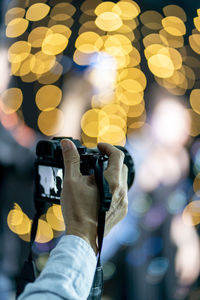 Close-up of hand holding camera