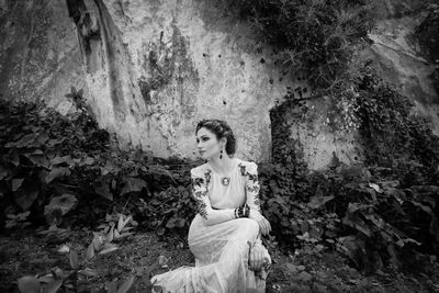 Woman looking away on rock