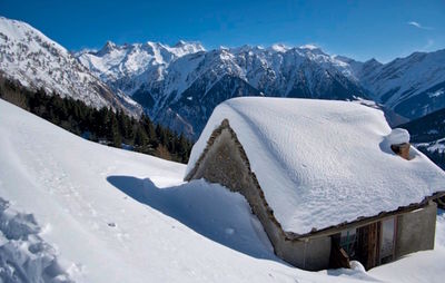 Snow covered mountains against sky