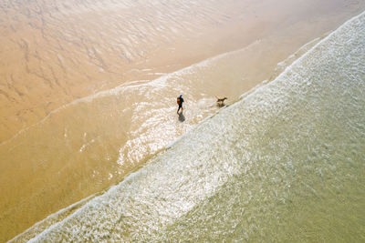 High angle view of man surfing in sea