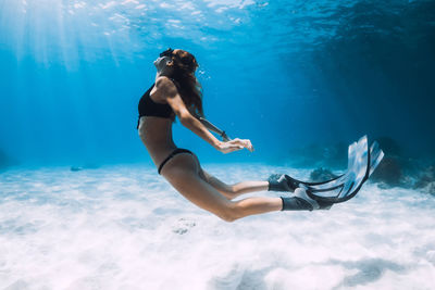 Woman swimming in sea